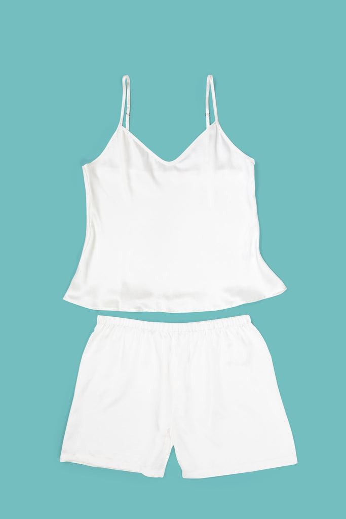 Ameline Ava Pearly White lustrious 100% Mulberry Silk Camisole Short Pajama Set, against blue background