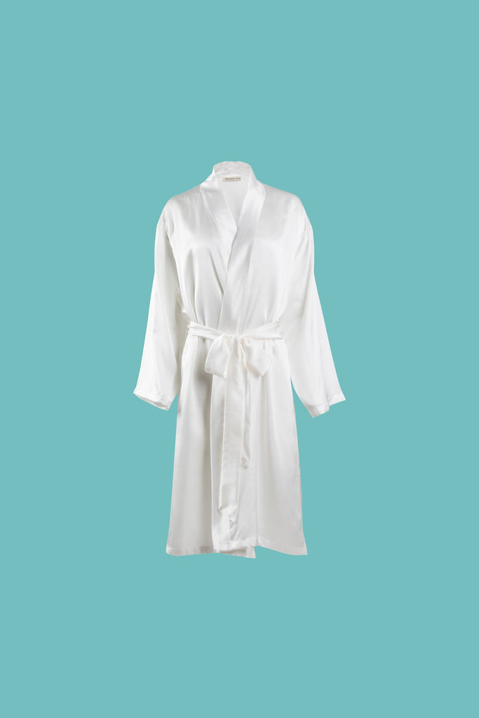 Ameline Ava Pearly White lustrious 100% Mulberry Silk Mid Length Robe, against blue background